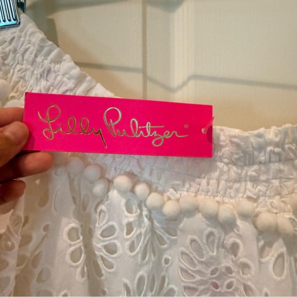 Your summer goto Lilly Pulitzer White Eyelet Off-Shoulder Tunic with PomPom Trim - Picture 3 of 10